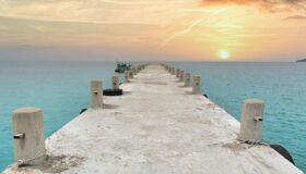 Panoramic view of Koh Rong’s white sand beaches for a scenic Koh Rong Tours banner by Legend Travel Group.